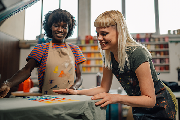 Two Women Screen Printing